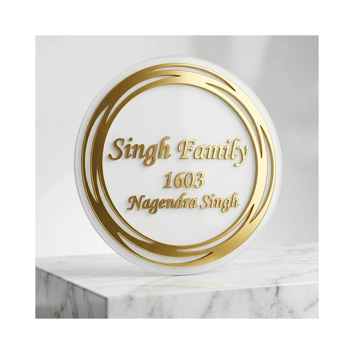 Surya Family: Sweeping gold-tone rings around a white circular family nameplate.