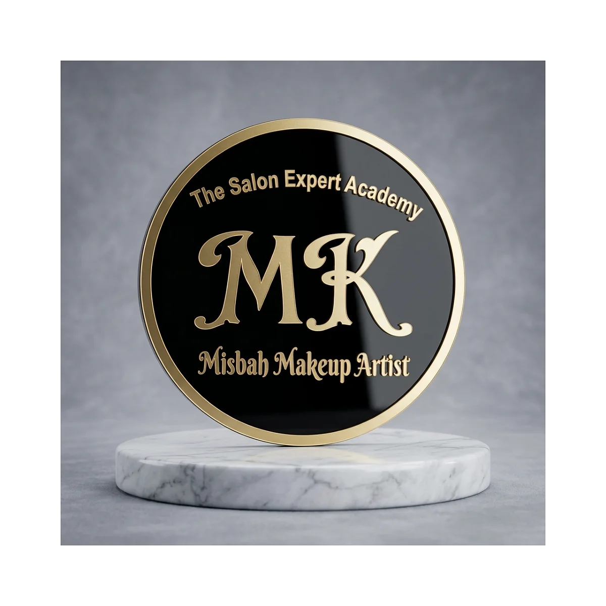 Monogram Studio: A black circular brand sign with a gold-tone rim and flowing monogram.