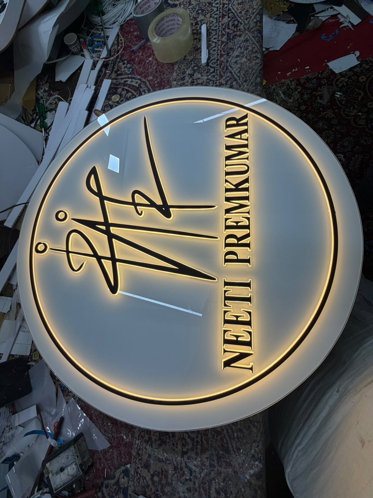 Original photograph of a custom acrylic nameplate with metallic lettering