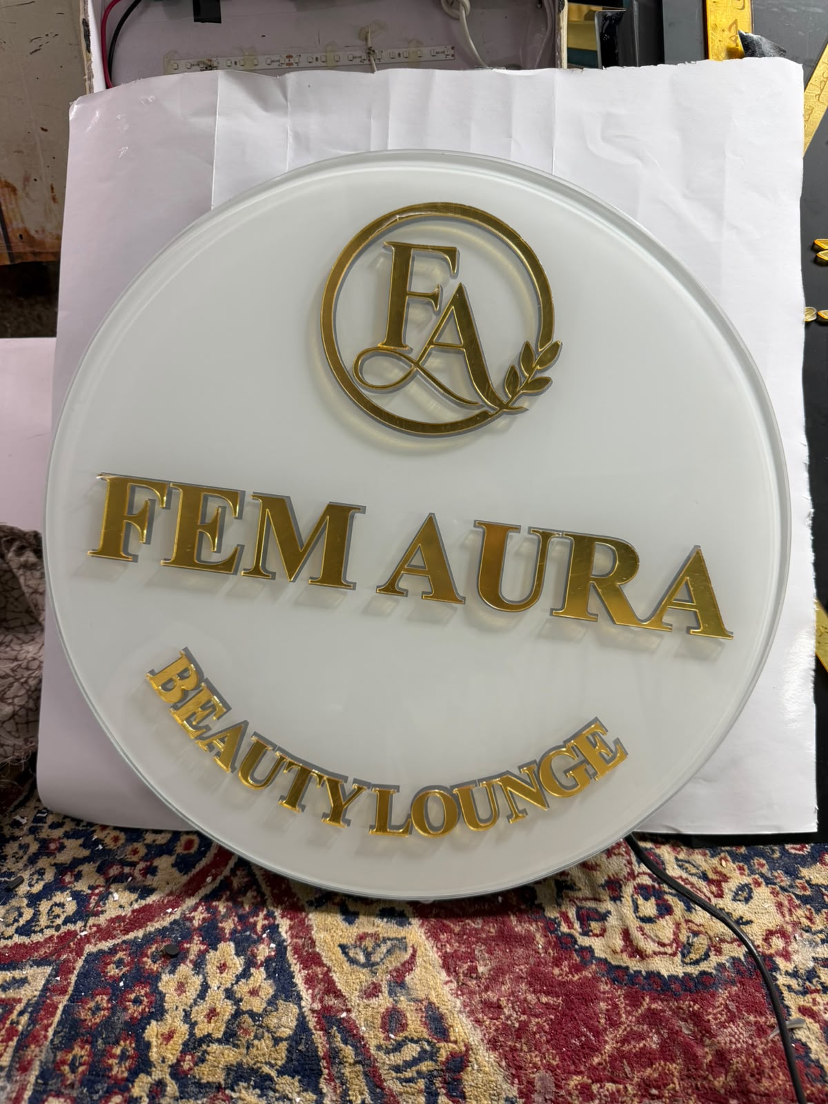 Original photograph of an oval acrylic nameplate with raised lettering